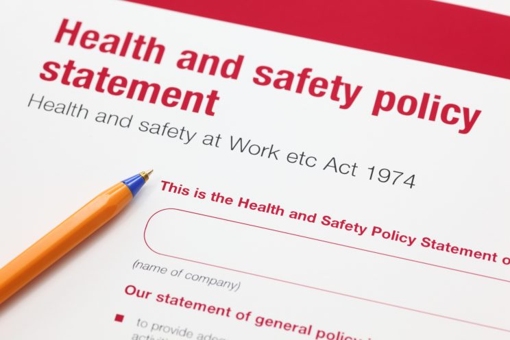 Health and safety policy statement and ballpoint pen.