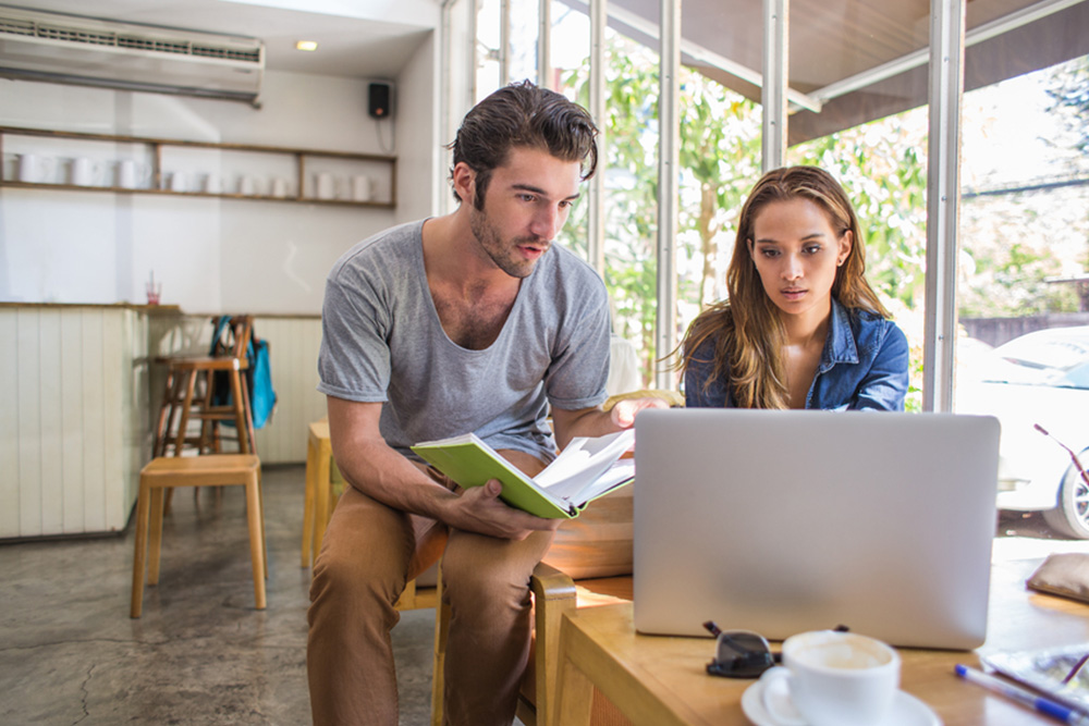 Man-Woman-Looking-At-Computer-9-16-38e4e2